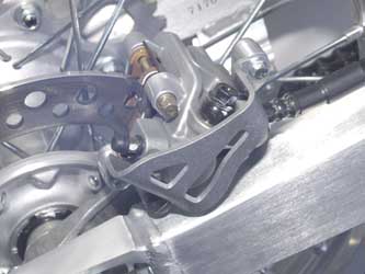 Main image of Works Connection Rear Caliper Guard CR/CRF 02-17